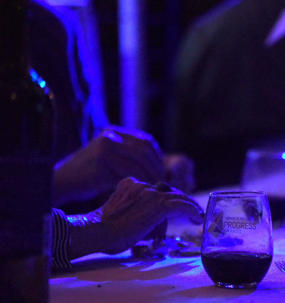 Food and drinks sit at an attendee's table